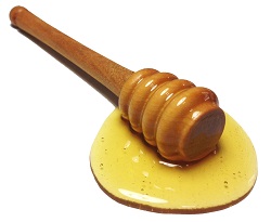 liquid honey and dipper image