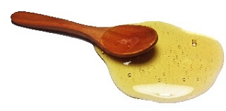 spoon of liquid honey image