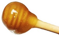 honey on wooden dipper image